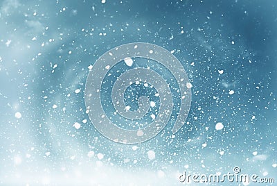 Winter Christmas sky with falling snow.Winter Christmas background.New Year greeting card with copy-space.Christmas landscape. Stock Photo