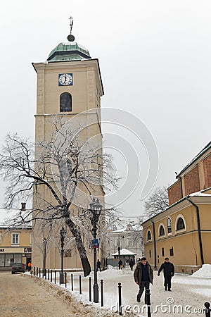 Winter church clock tower on Farny Square in Rzeszow, Poland Editorial Stock Photo