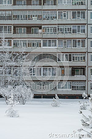 Winter cityscape, facade of an apartment building in Russia. Vertical photo Stock Photo