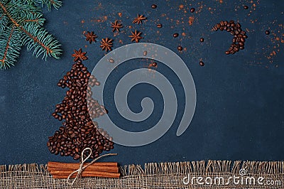 Winter composition Christmas tree made by coffee beans with night sky by anise star and chocolate. Greeting card New Year. Stock Photo