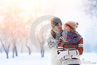 Winter couple. Happy Couple Having Fun Outdoors. Snow. Winter Vacation. Outdoor . Stock Photo