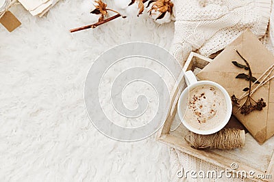 Winter cozy background with cup of coffee, warm sweater and old letters. Stock Photo