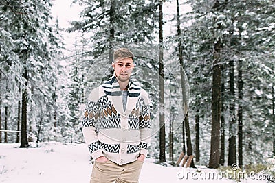 Outdoor portrait of handsome man in coat and scurf. Stock Photo