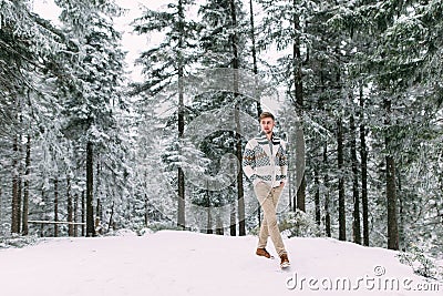 Outdoor portrait of handsome man in coat and scurf. Stock Photo