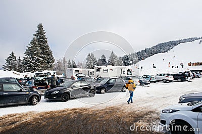 Winter day with snow and ski slope seen from parking area with k Editorial Stock Photo
