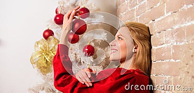 Winter decoration. Winter holidays concept. Girl decorate christmas tree with ornaments. Waiting for christmas. Girl Stock Photo