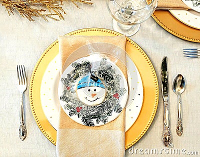 Winter Dinner Table Setting with Snowman Stock Photo