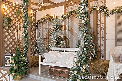 Winter exterior of a country house with Christmas decorations in the American style. Snow-covered courtyard with a porch Stock Photo