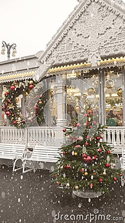 The winter exterior of a country house with Christmas ornaments Fir Wreath Snow Stock Photo