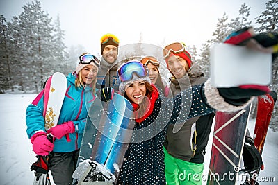 winter, extreme sport and people concept - Group of smiling friends making selfie Stock Photo