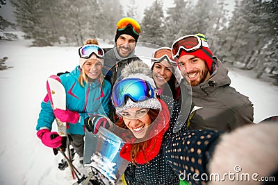 Winter, extreme sport and people concept - friends having fun on Stock Photo