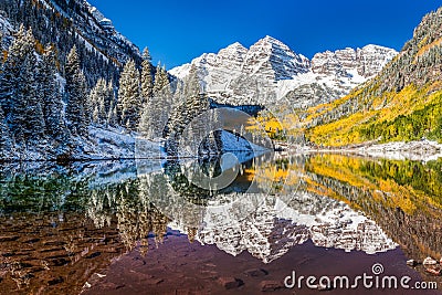 Winter and Fall foliage at Maroon Bells, CO Stock Photo