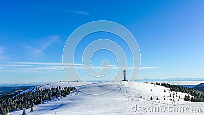 Winter Feldberg Ski Resort in Black Forest of German, tower at rear of treeless area Stock Photo