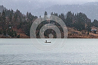 Winter fishing at Colibita lake. Stock Photo
