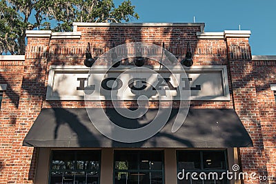 WINTER GARDEN, FLORIDA: MAY 29, 2019 - Local sign at Plant Street Market a brick building featuring indoor dining with local food Editorial Stock Photo