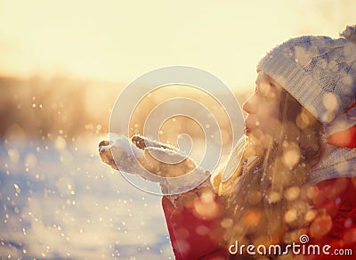 Winter Girl Blowing Snow Stock Photo