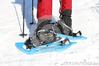 Winter hiking in the mountains on snowshoes with a backpack and tent. Stock Photo