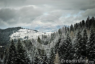 Winter hills with cloudy sky. Stock Photo