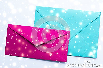 Winter holiday blank paper envelopes on marble with shiny snow flatlay background, love letter or Christmas mail card design Stock Photo