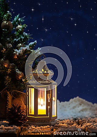 Winter Holiday Scene With Glowing Lantern Stock Photo