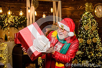 Winter ideas. Celebrate new year. December sale. Surprise concept. Santa Claus delivering gift. Delivery service Stock Photo