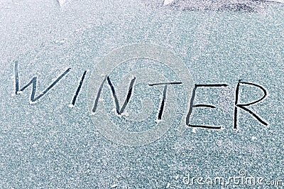 Winter inscription on snow on the front window of car Stock Photo