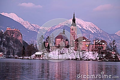 Winter landscape of Bled Lake and island church on sunset Stock Photo