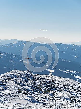 Winter landscape in the mountains in Slovakia with a cross Stock Photo