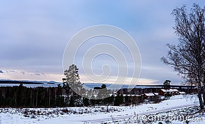 View of winter landscape during sunset from the village of TÃ¤llberg, Dalarna, Sweden Stock Photo