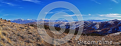 Winter Landscape panorama Oquirrh and Wasatch mountain views from Yellow Fork Canyon County Park Rose Canyon rim hiking trail by R Stock Photo