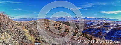 Winter Landscape panorama Oquirrh and Wasatch mountain views from Yellow Fork Canyon County Park Rose Canyon rim hiking trail by R Stock Photo