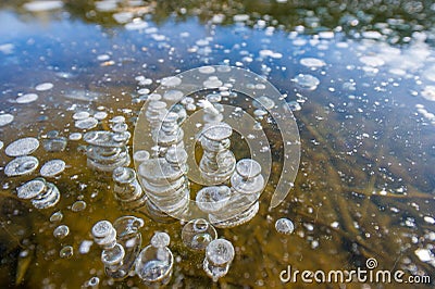 Winter landscape photography, air bubbles froze in the water. Fancy drawing Stock Photo