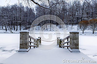 Winter landscape with pier and snowy forest Stock Photo