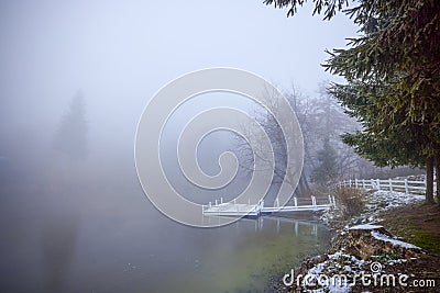 Winter landscape with a pontoon on a lake Stock Photo