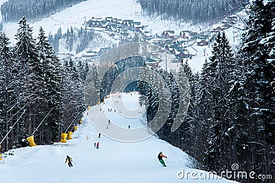 Winter landscape ski slope of resort Bukovel with skiers Stock Photo