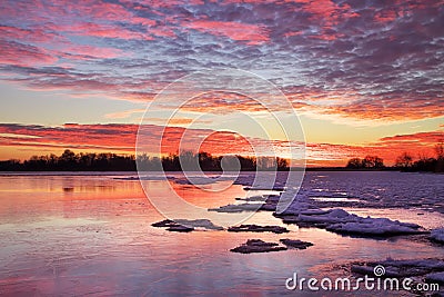 Winter landscape with sunset fiery sky. Stock Photo