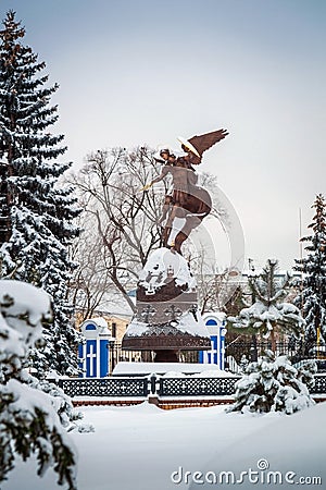 Winter landscape view of the bronze sculpture of the Archangel Michael in Kiev on Vladimirskaya mountain Stock Photo