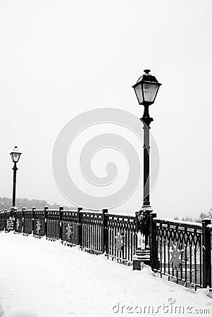 Winter landscape and vintage style lanterns. Stock Photo