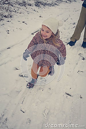 Winter magic. Little girl at snow. Stock Photo