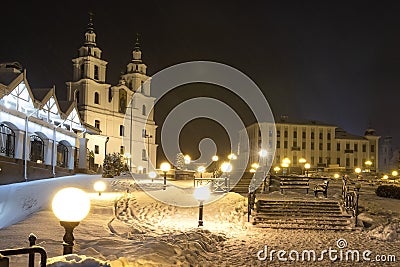 Winter Minsk, Belarus. Snowy night cityscape in Christmas time. Photo of Cathedral of the Descent of the Holy Spirit. Stock Photo