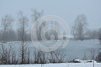 Winter mist rises over frozen water in Eastern Washington State Stock Photo