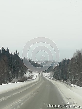 Winter, mountain road, breathtaking, danger, winter forest, winter road, descent from the mountain, twists like a snake, Stock Photo