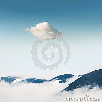 Winter mountains and lonely cloud in the sky Stock Photo
