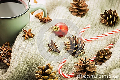 Winter and New Year theme. Christmas hot steaming cup of glint wine with spices, anise, fir cones, cookies in a shape of star, red Stock Photo