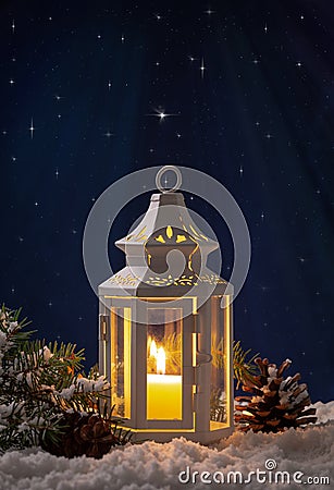 Winter Night Scene of Glowing Lantern Stock Photo