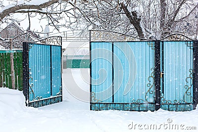 Winter old dilapidated rickety fence. Snow blizzard Stock Photo