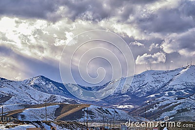 Winter Panorama of Oquirrh Mountain range snow capped, which includes The Bingham Canyon Mine or Kennecott Copper Mine, rumored th Stock Photo