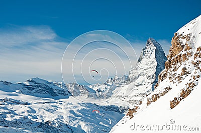 Winter paragliding over the alps Stock Photo