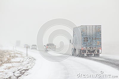 Winter road conditions with vehicles on I-80 in Southern Wyoming near Vedauwoo and Buford, WY Stock Photo