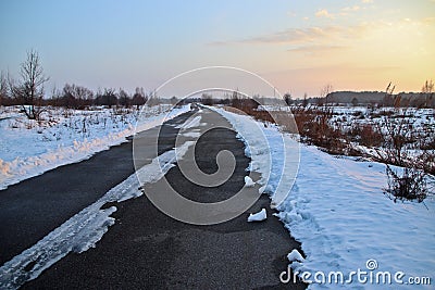 Winter road in February through the snow-covered steppe Stock Photo